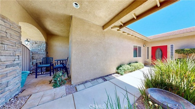 12443 Bannock Dr, Apple Valley, CA 92308 - doorway to property featuring a patio and stucco siding