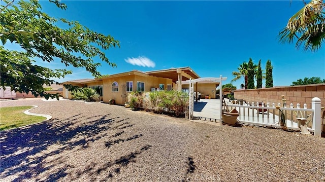12443 Bannock Dr, Apple Valley, CA 92308 - view of front of home featuring stucco siding and a patio area