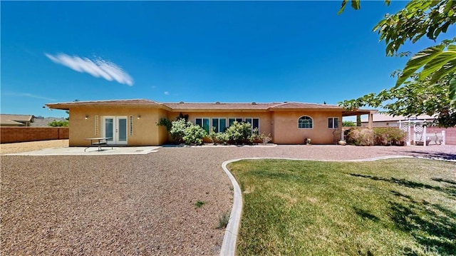 12443 Bannock Dr, Apple Valley, CA 92308 - rear view of house with french doors, stucco siding, and a patio area