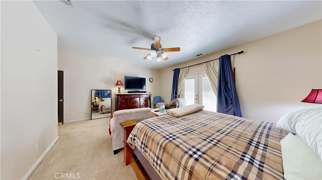 12443 Bannock Dr, Apple Valley, CA 92308 - bedroom featuring french doors, light colored carpet, access to exterior, ceiling fan, and a textured ceiling