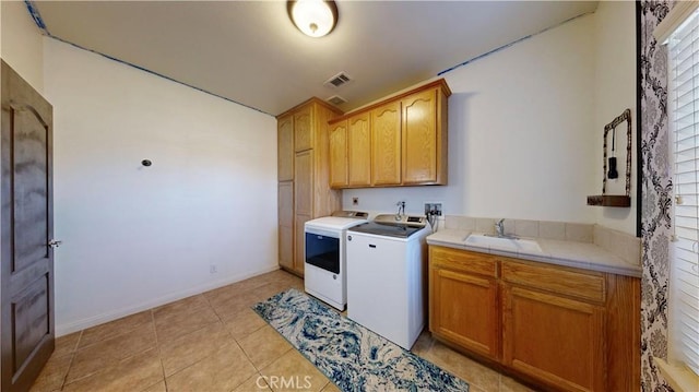 12443 Bannock Dr, Apple Valley, CA 92308 - laundry area with cabinet space, separate washer and dryer, and light tile patterned floors
