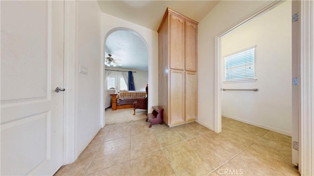 12443 Bannock Dr, Apple Valley, CA 92308 - hall featuring arched walkways and light tile patterned flooring