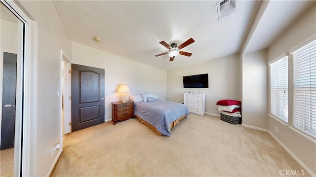 12443 Bannock Dr, Apple Valley, CA 92308 - bedroom featuring light colored carpet, multiple windows, and ceiling fan