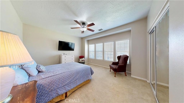 12443 Bannock Dr, Apple Valley, CA 92308 - carpeted bedroom with a closet, ceiling fan, and a textured ceiling