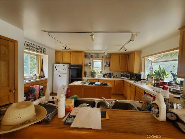 535 N Dart Canyon Rd, Crestline, CA 92325 - kitchen featuring freestanding refrigerator, rail lighting, gas stovetop, and open shelves