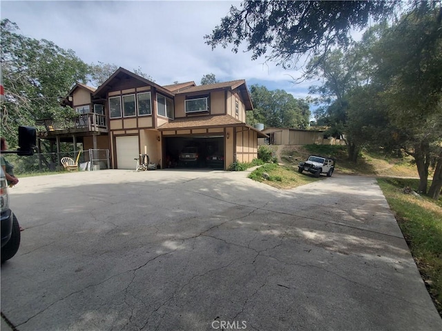 535 N Dart Canyon Rd, Crestline, CA 92325 - view of front of property featuring stucco siding, concrete driveway, and an attached garage
