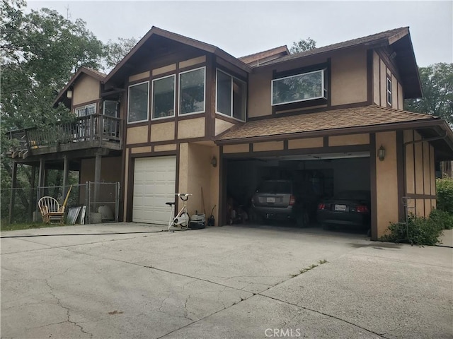 535 N Dart Canyon Rd, Crestline, CA 92325 - view of front of property featuring an attached garage, stucco siding, and driveway