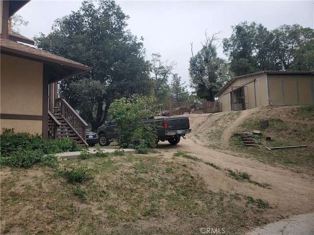 535 N Dart Canyon Rd, Crestline, CA 92325 - view of yard with dirt driveway and stairway