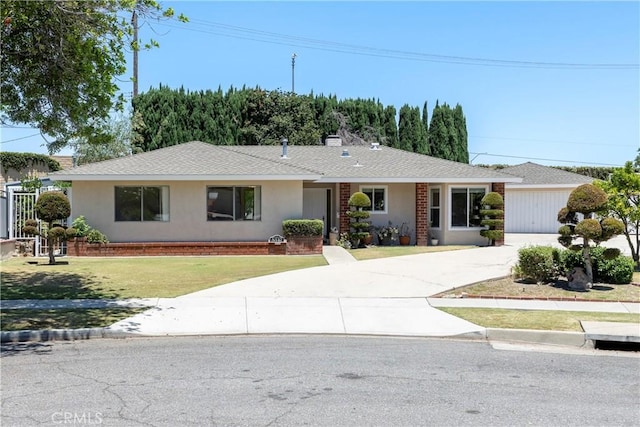 5347 E Bergh Dr, Anaheim Hills, CA 92807 - ranch-style house featuring driveway, a front yard, stucco siding, a garage, and roof with shingles