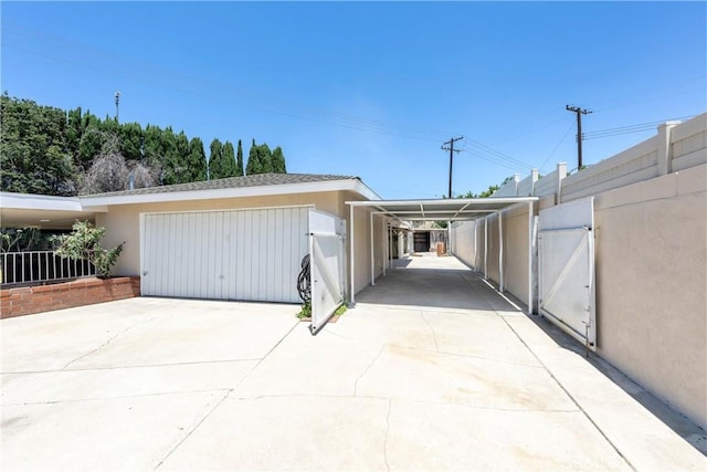 5347 E Bergh Dr, Anaheim Hills, CA 92807 - garage with a gate, driveway, and an attached carport