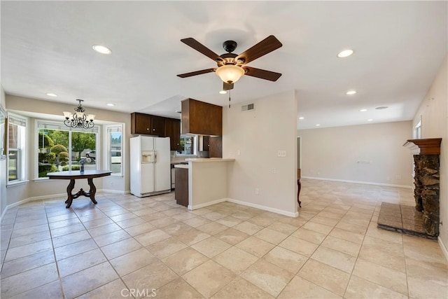 5347 E Bergh Dr, Anaheim Hills, CA 92807 - kitchen featuring white refrigerator with ice dispenser, light countertops, recessed lighting, dark brown cabinets, and open floor plan