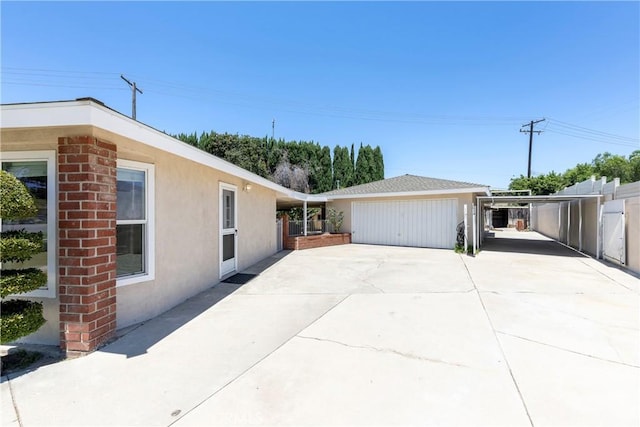 5347 E Bergh Dr, Anaheim Hills, CA 92807 - view of side of property featuring stucco siding and concrete driveway