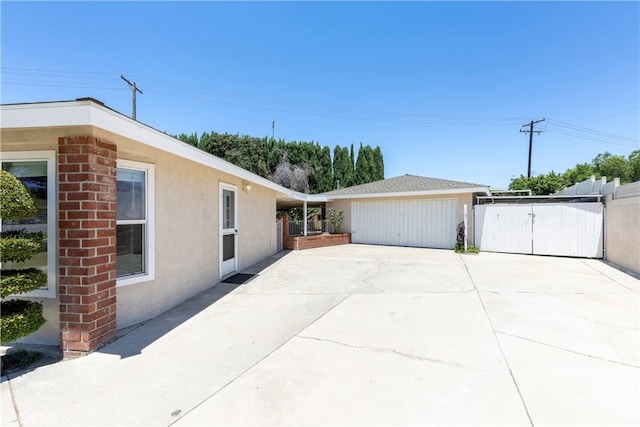 5347 E Bergh Dr, Anaheim Hills, CA 92807 - view of side of home featuring a gate and stucco siding