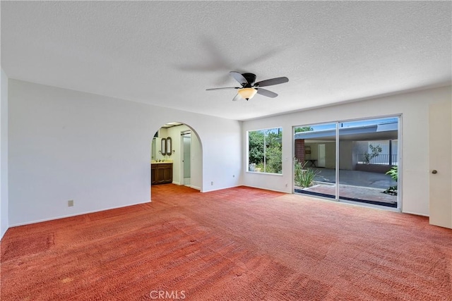 5347 E Bergh Dr, Anaheim Hills, CA 92807 - carpeted spare room featuring a ceiling fan, arched walkways, and a textured ceiling