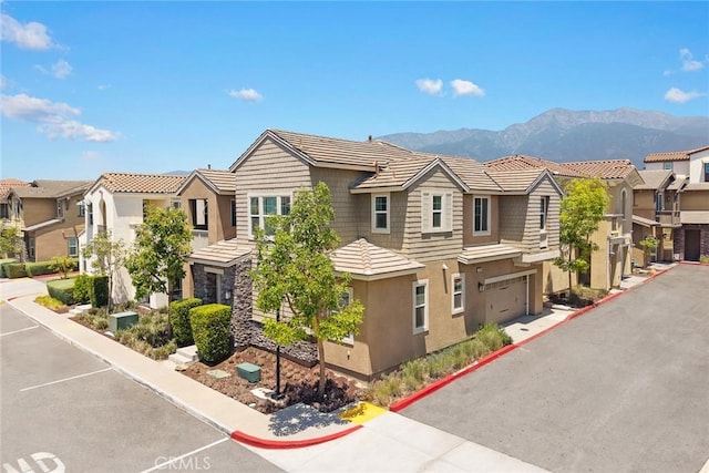 12260 Chorus Dr, Rancho Cucamonga, CA 91739 - view of front of home featuring stucco siding, a residential view, a mountain view, a garage, and a tile roof