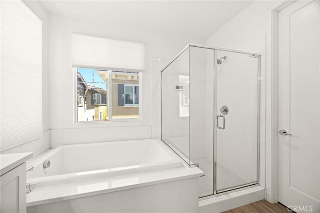 12260 Chorus Dr, Rancho Cucamonga, CA 91739 - full bath featuring a stall shower, a bath, vanity, and wood finished floors