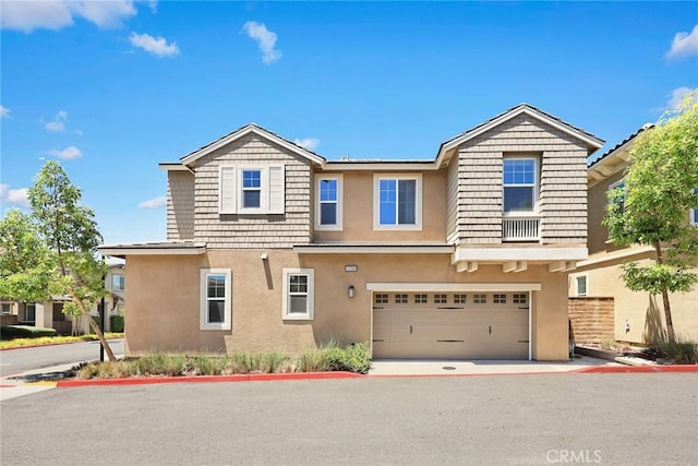 12260 Chorus Dr, Rancho Cucamonga, CA 91739 - view of front of property with stucco siding, an attached garage, and driveway