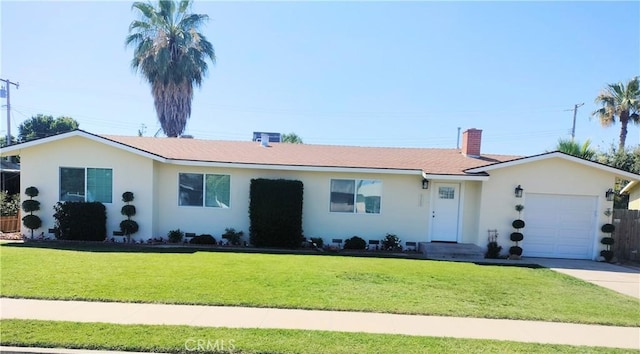 900 S Ann St, Tulare, CA 93274 - ranch-style home with an attached garage, a front lawn, stucco siding, a chimney, and concrete driveway