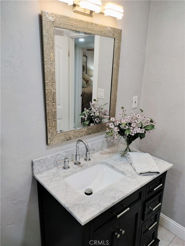900 S Ann St, Tulare, CA 93274 - bathroom featuring vanity and baseboards