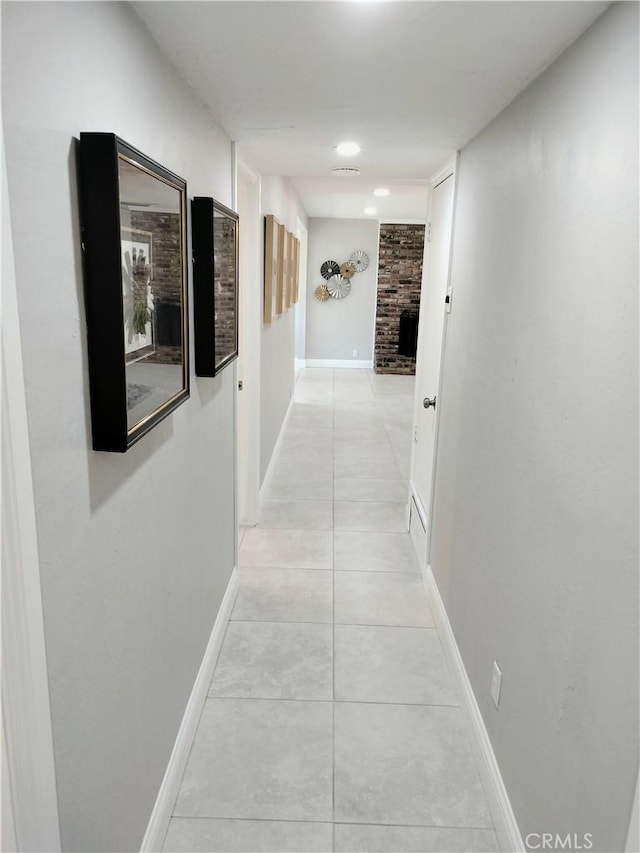 900 S Ann St, Tulare, CA 93274 - corridor featuring light tile patterned flooring and baseboards