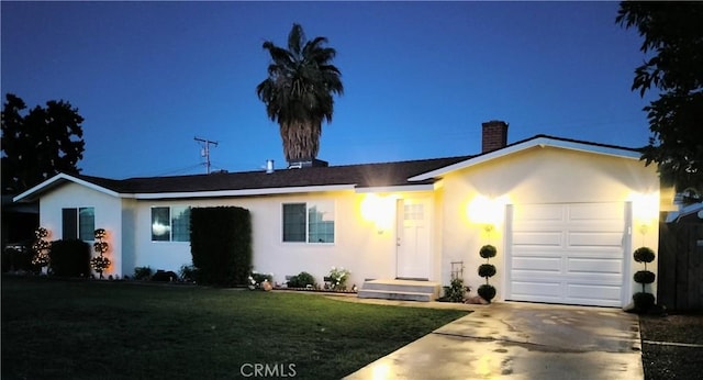 900 S Ann St, Tulare, CA 93274 - ranch-style house featuring a chimney, stucco siding, a garage, and driveway