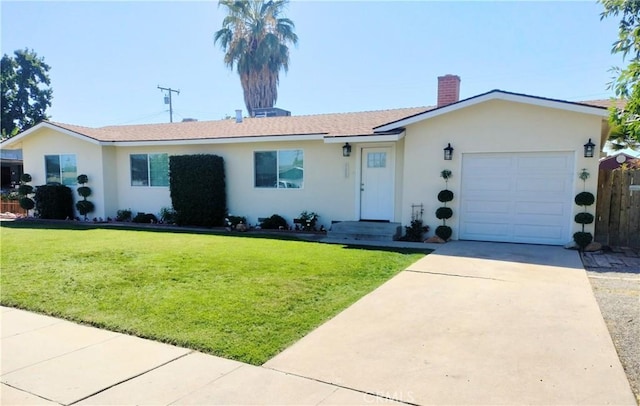900 S Ann St, Tulare, CA 93274 - ranch-style house with an attached garage, stucco siding, a chimney, a front yard, and driveway