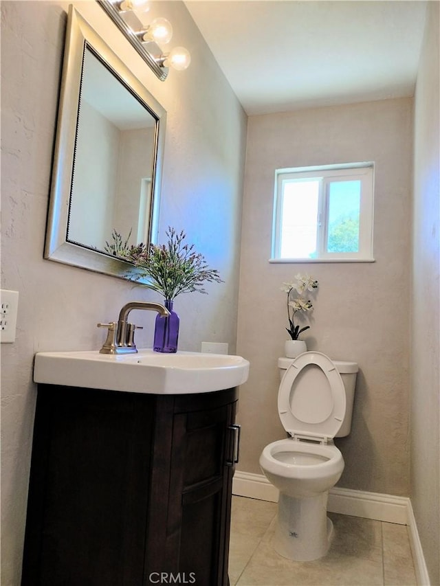 900 S Ann St, Tulare, CA 93274 - half bath featuring vanity and tile patterned flooring