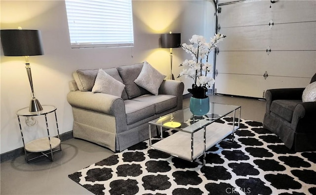 900 S Ann St, Tulare, CA 93274 - living room with baseboards and concrete flooring