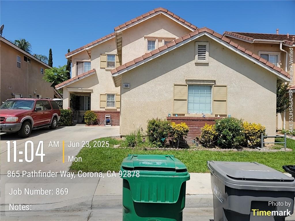 868 Pathfinder Way, Corona, CA 92878 - view of front facade with stucco siding and a tiled roof