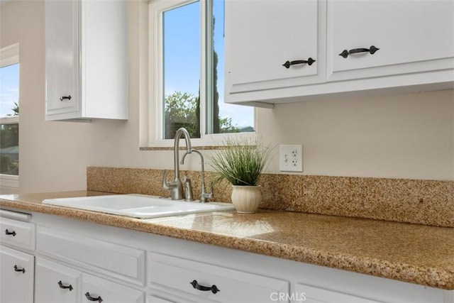 3746 Balboa Dr, Oceanside, CA 92056 - kitchen featuring healthy amount of natural light and white cabinetry