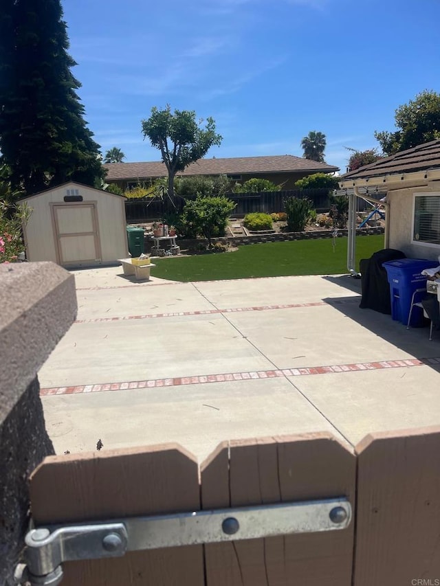 4906 Via Hinton, Carlsbad, CA 92008 - view of patio featuring a shed