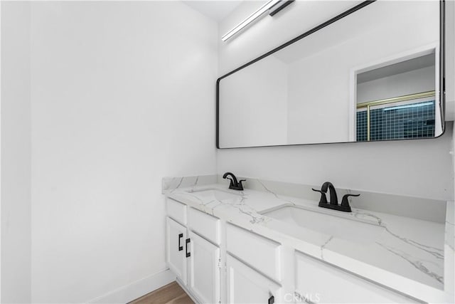 36829 Burroughs Way, Palmdale, CA 93552 - bathroom featuring double vanity and wood finished floors