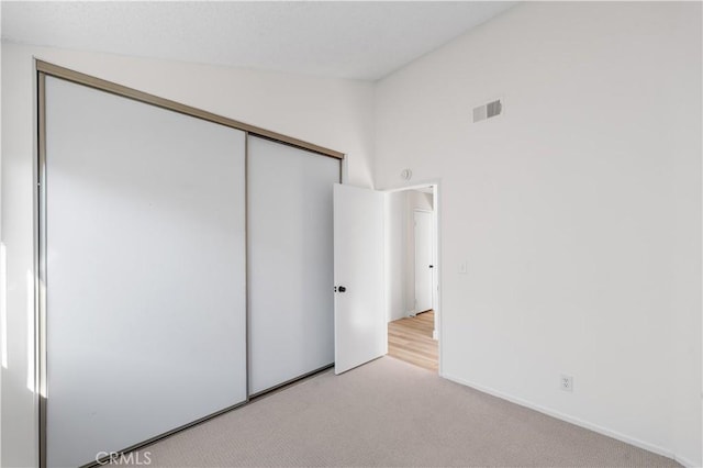 36829 Burroughs Way, Palmdale, CA 93552 - unfurnished bedroom featuring a closet, vaulted ceiling, and light colored carpet