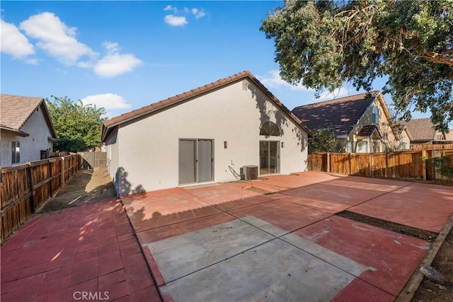 36829 Burroughs Way, Palmdale, CA 93552 - rear view of house with stucco siding, a tiled roof, a fenced backyard, and a patio area