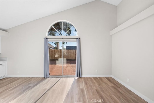 36829 Burroughs Way, Palmdale, CA 93552 - unfurnished dining area with wood finished floors and high vaulted ceiling