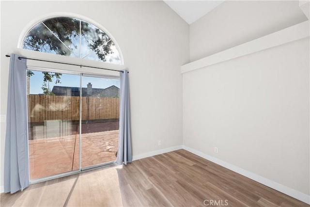 36829 Burroughs Way, Palmdale, CA 93552 - unfurnished room with wood finished floors and high vaulted ceiling