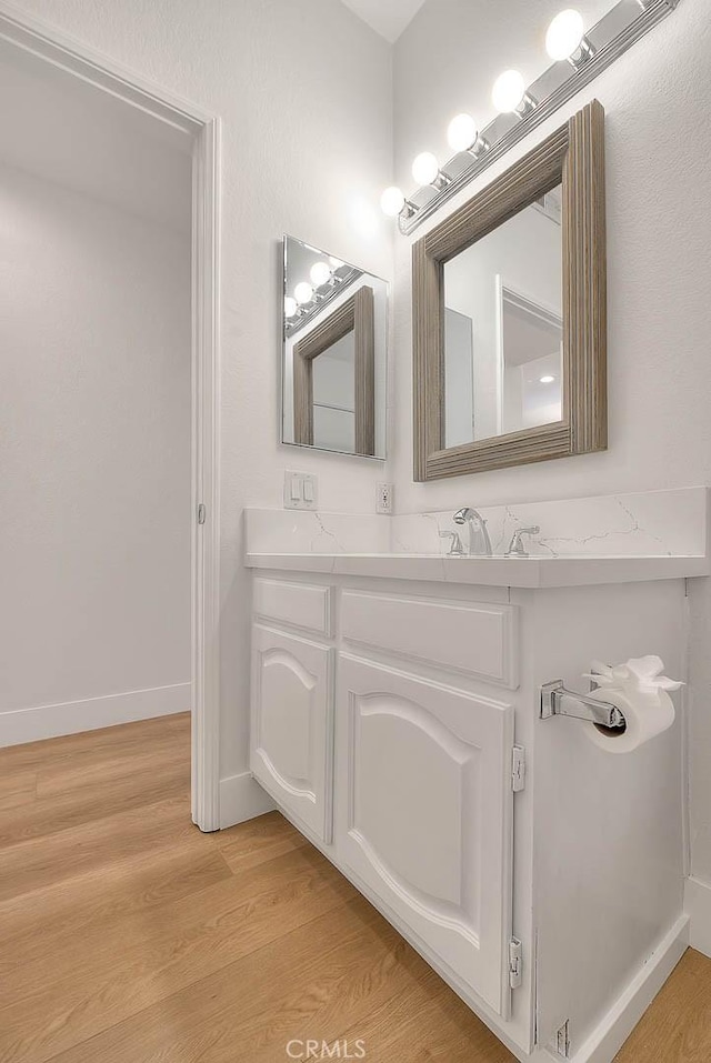 2914 Crape Myrtle Cir, Chino Hills, CA 91709 - bathroom with wood finished floors and double vanity