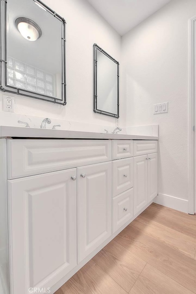2914 Crape Myrtle Cir, Chino Hills, CA 91709 - full bathroom featuring double vanity and wood finished floors