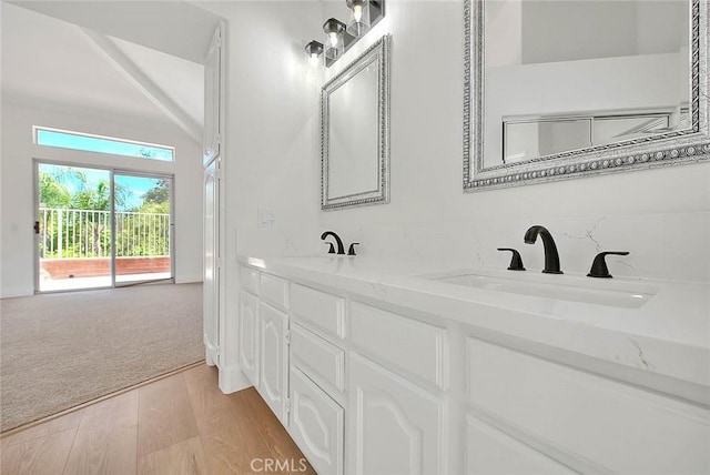2914 Crape Myrtle Cir, Chino Hills, CA 91709 - full bathroom with double vanity, wood finished floors, and vaulted ceiling
