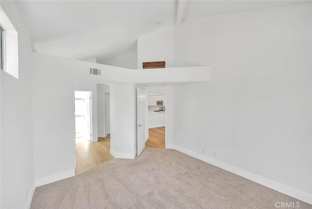 2914 Crape Myrtle Cir, Chino Hills, CA 91709 - unfurnished room with light carpet, beamed ceiling, high vaulted ceiling, and healthy amount of natural light