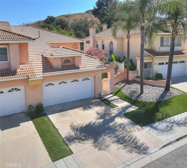 2914 Crape Myrtle Cir, Chino Hills, CA 91709 - mediterranean / spanish-style home featuring stucco siding, driveway, a garage, and a tile roof