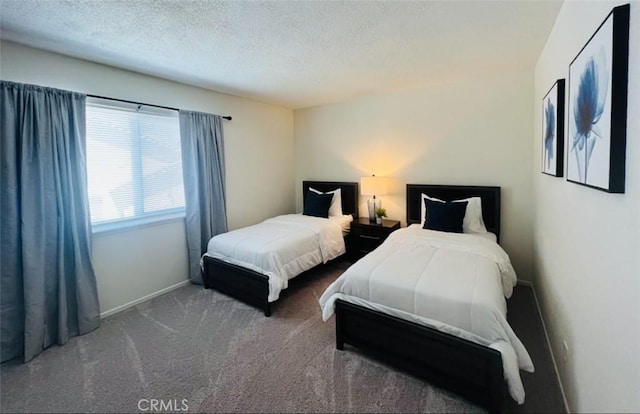 13330 Tamarisk Rd, Victorville, CA 92395 - carpeted bedroom featuring a textured ceiling and baseboards