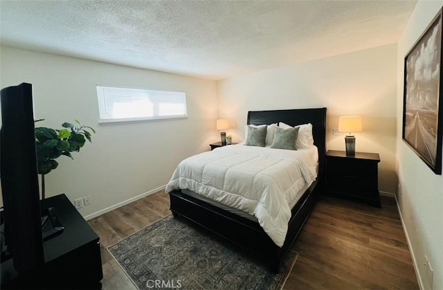 13330 Tamarisk Rd, Victorville, CA 92395 - bedroom with wood finished floors and a textured ceiling
