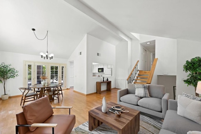 4205 Caminito Pintoresco, San Diego, CA 92108 - living room with french doors, light wood-type flooring, high vaulted ceiling, a chandelier, and stairs