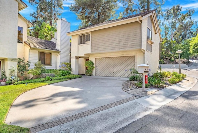 4205 Caminito Pintoresco, San Diego, CA 92108 - traditional-style house featuring an attached garage, driveway, stucco siding, and a chimney