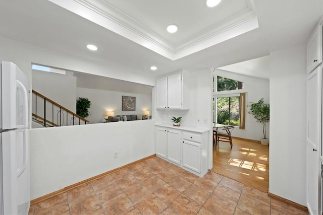 4205 Caminito Pintoresco, San Diego, CA 92108 - kitchen with freestanding refrigerator, crown molding, white cabinets, light countertops, and recessed lighting
