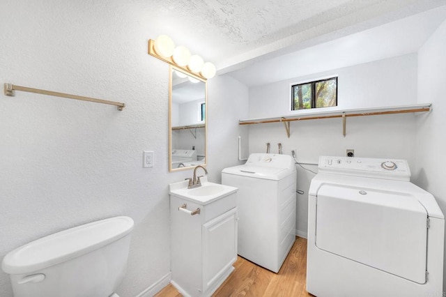 4205 Caminito Pintoresco, San Diego, CA 92108 - washroom featuring separate washer and dryer and light wood finished floors
