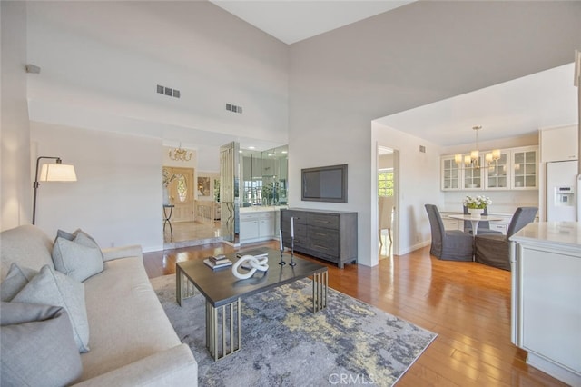 2039 Channelford Rd, Westlake Village, CA 91361 - living area with a chandelier and wood finished floors