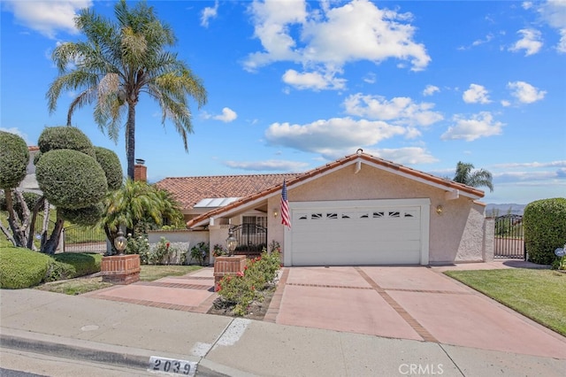 2039 Channelford Rd, Westlake Village, CA 91361 - view of front of house with a garage, stucco siding, a gate, and driveway