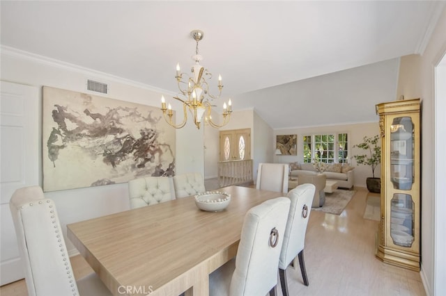 2039 Channelford Rd, Westlake Village, CA 91361 - dining room with a chandelier, light wood-type flooring, ornamental molding, and lofted ceiling